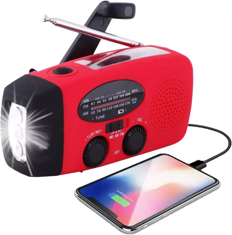 Emergency Weather Radio — Hand Crank & Solar with Flashlight and USB Phone Charger — charging a phone from the built-in 1000 mAh battery